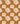 A seamless floral pattern with white flowers and leaves on a warm brown background, featuring superior absorption - Bubble & Blend's Keukendoek Refined.