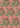 Een krachtig tropisch patroon met een mix van groene bladeren en diverse bloemen op een koraalachtergrond, dat een zomerse, exotische uitstraling geeft aan de Keukendoek Graceful Elegance van Bubble & Blend.