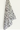A Kitchen Towel Monotique from My Store, a super-absorbent fabric with a black and gray leafy pattern draped over a white surface, creating an elegant contrast.